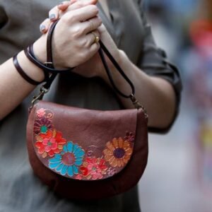 brown leather bag with flowers
