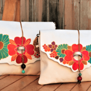 white leather bag with flowers