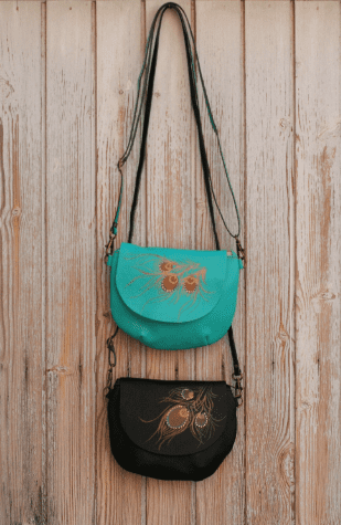 Round leather bag with feather