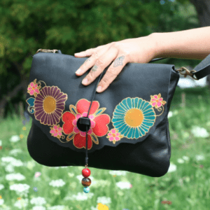 black leather bag with flowers